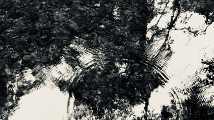 Black & white photo of ripple on surface of river
