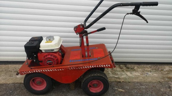 Old red turf cutter