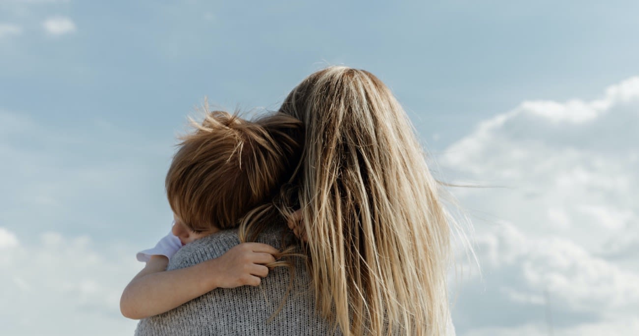 view of mom holding a child