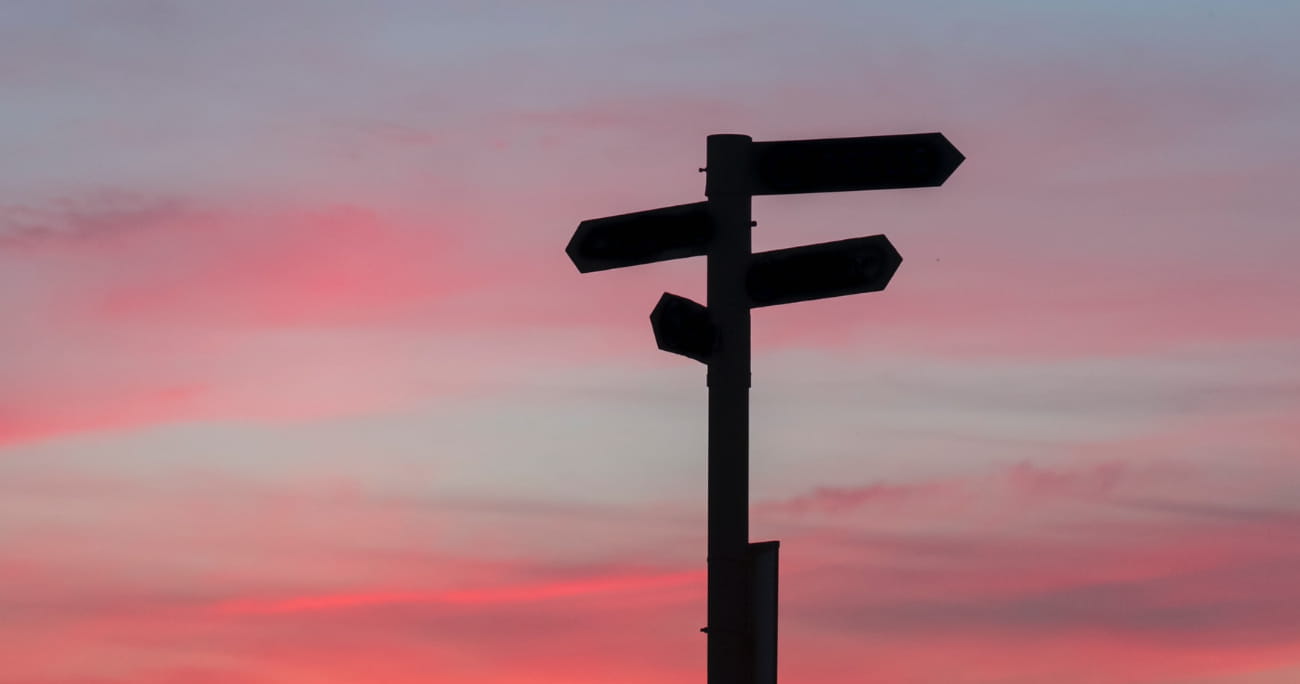 sign with multiple arrows pointing in different directions