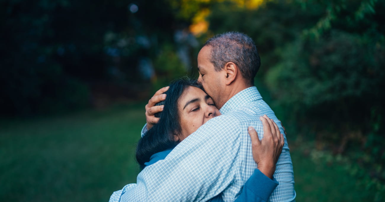 husband and wife embracing