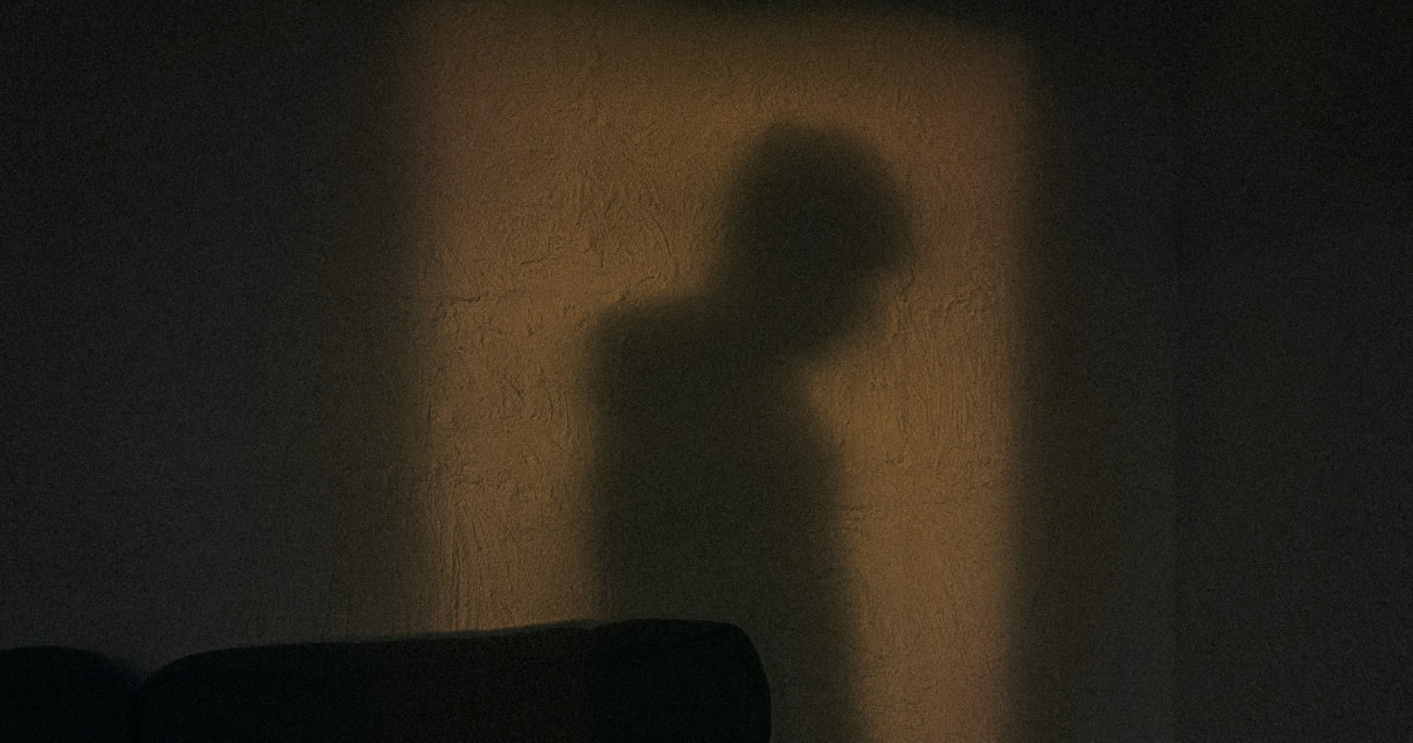 shadow of man against the wall