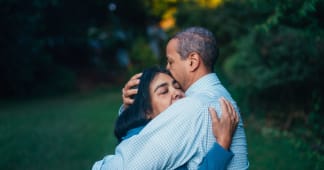 husband and wife embracing