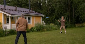 elderly man and teenager playing frisbee outdoors | Ron Lach, via Pexels