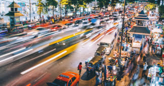 busy street at night with blurred headlights from cars