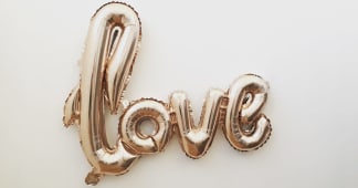 balloon shaped into the word love
