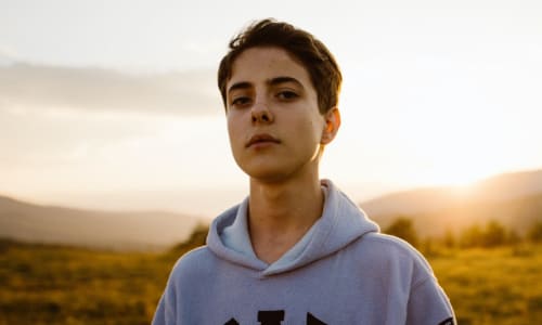 teenage boy staring at the camera