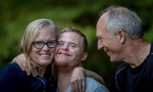 disabled adult with his parents