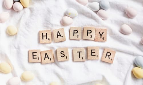 scrabble tiles spelling out Happy Easter