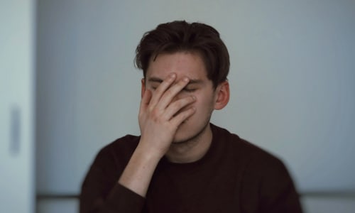dad with head in hands
