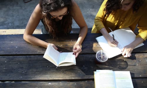 overhead view of two teen girls doing a Bible study
