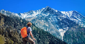 Man viewing mountain scenery whlie hiking