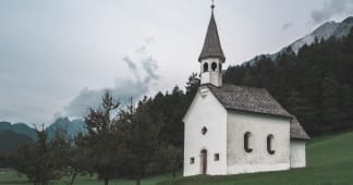 church in the country with trees in the background