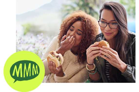 women eating burgers delivery