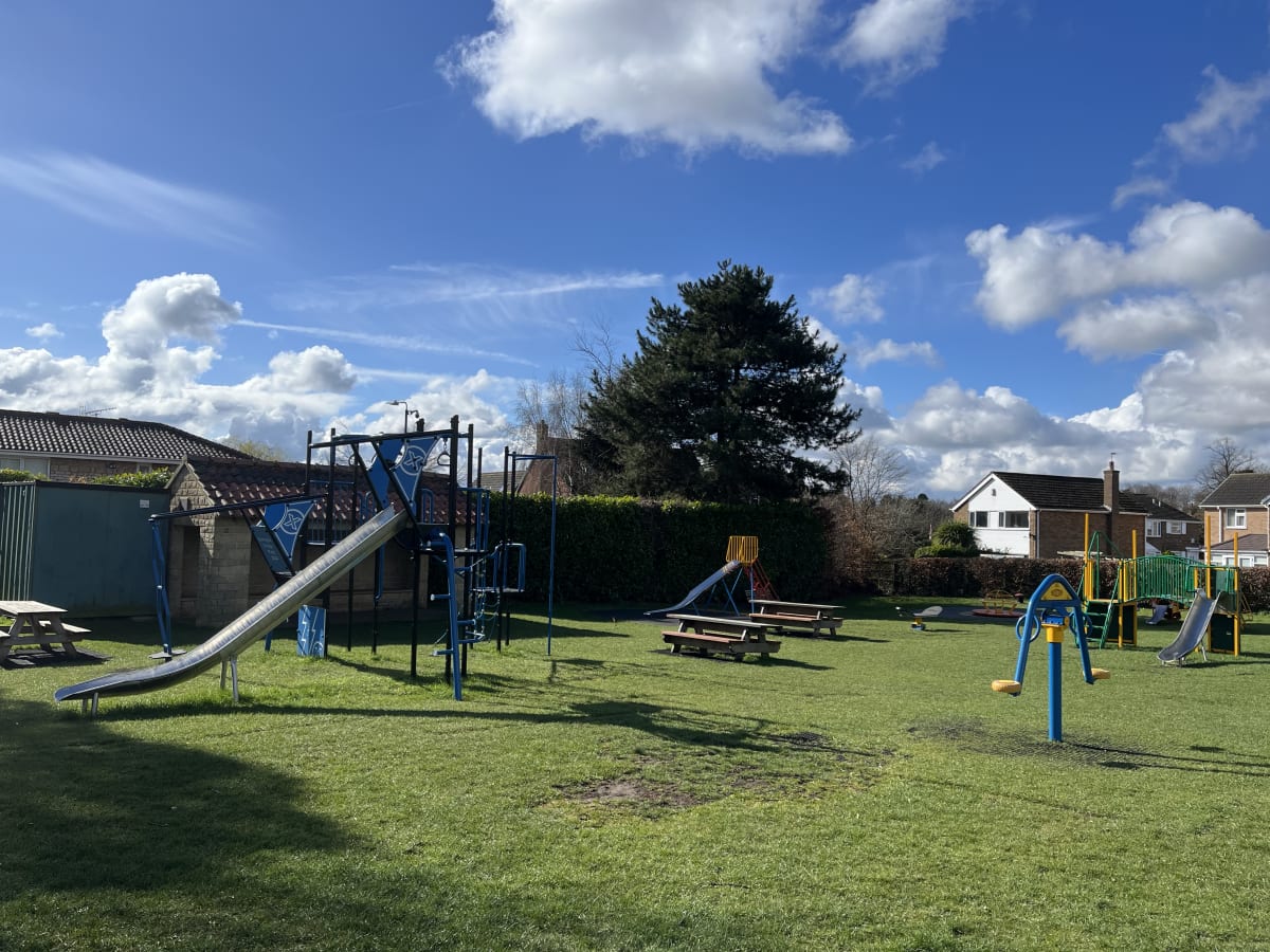 Children’s playground beside the open Village Field