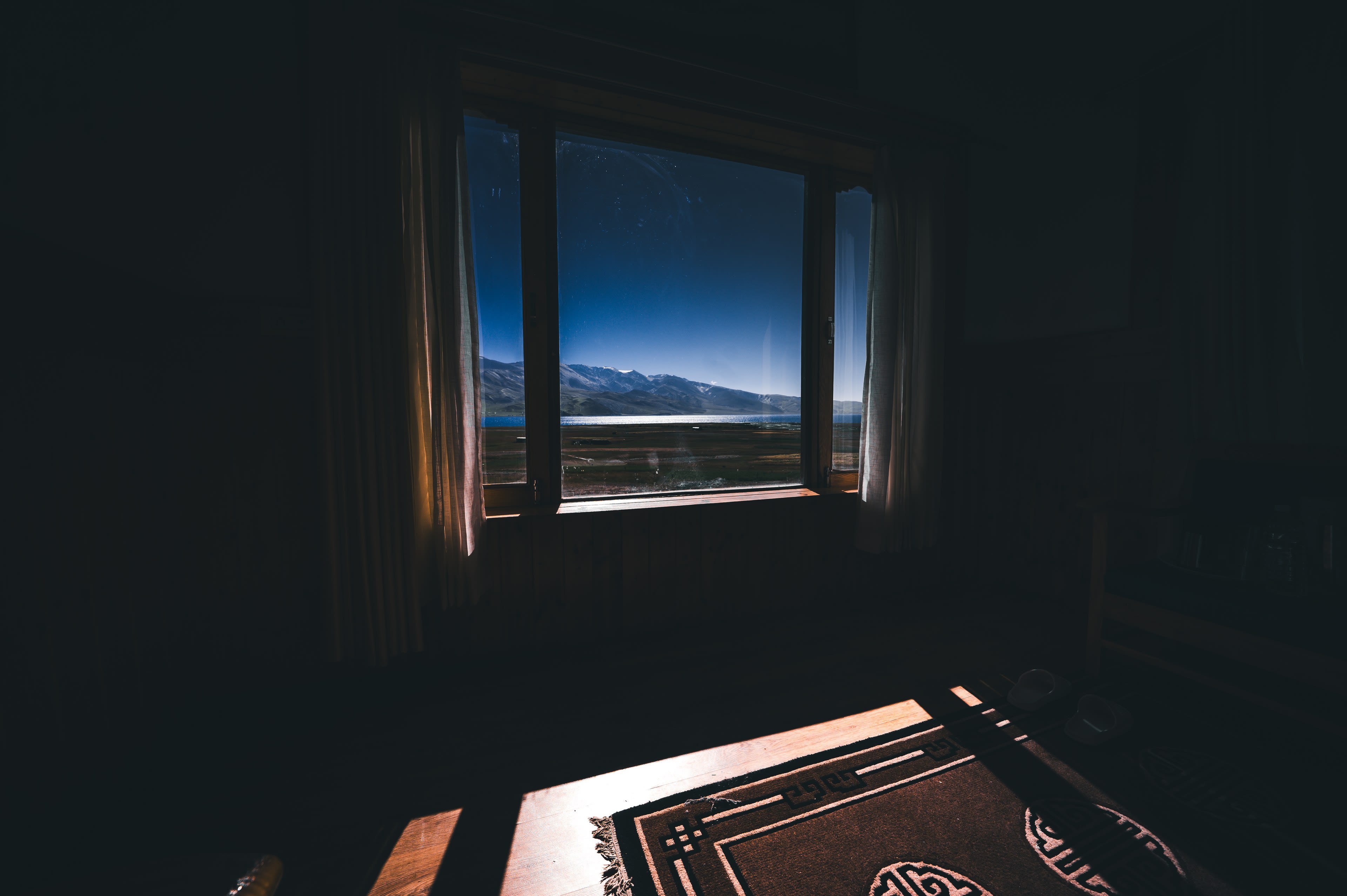 Morning light through a small window into a dark traditional room