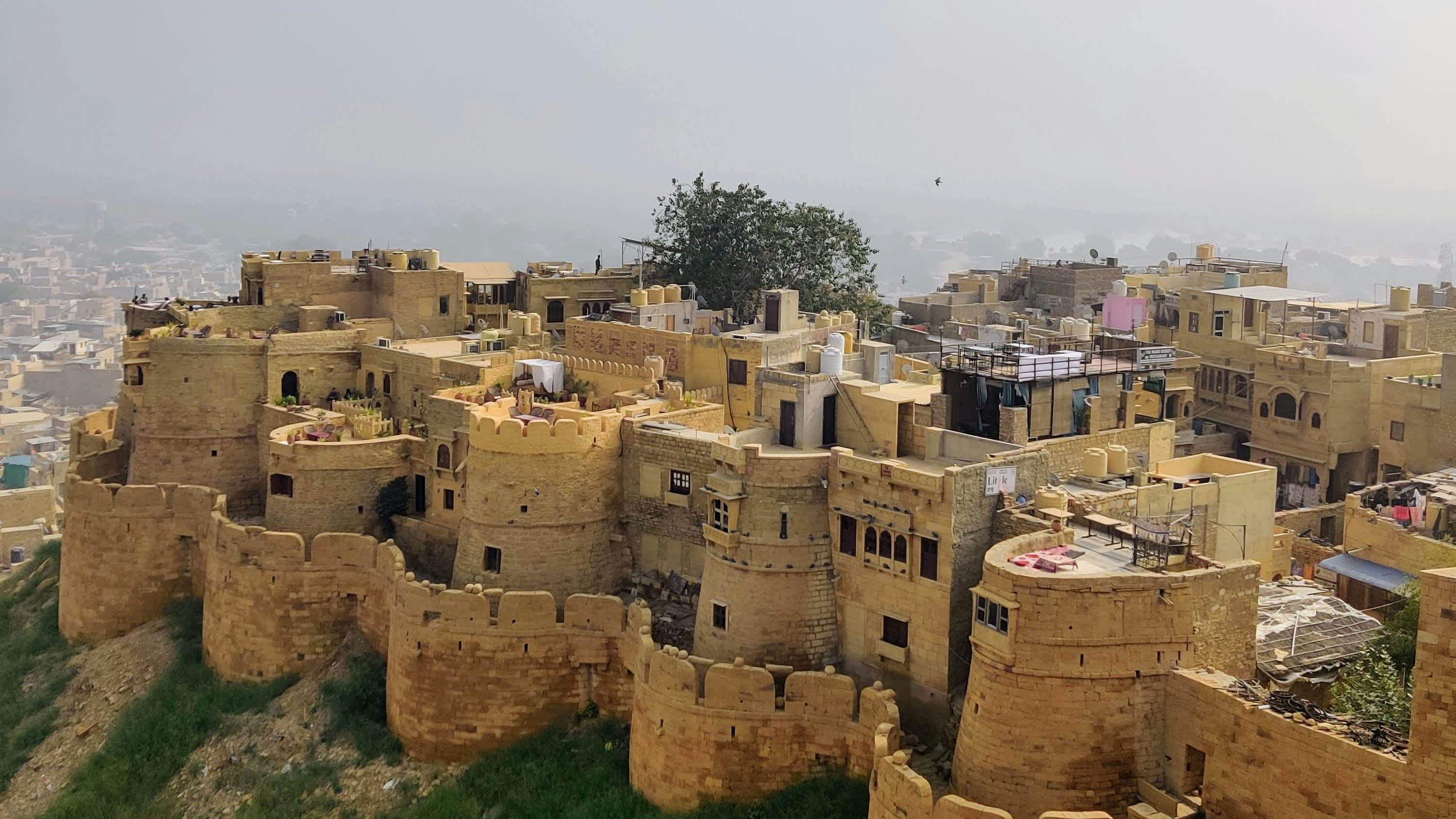 Golden sandstone rooftops of Jaisalmer spreading below the fort walls