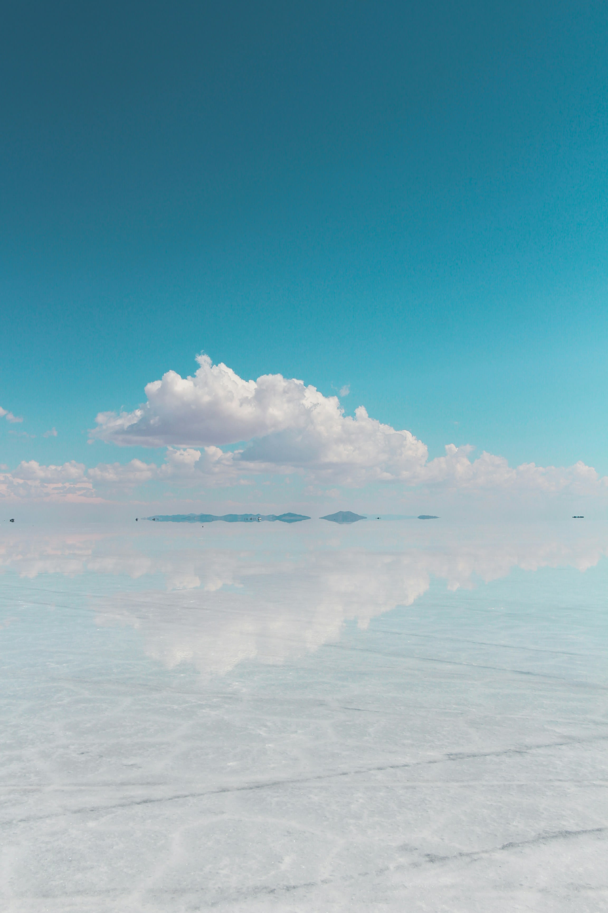 Clouds reflected in the flooded salt flat so sky and ground merge