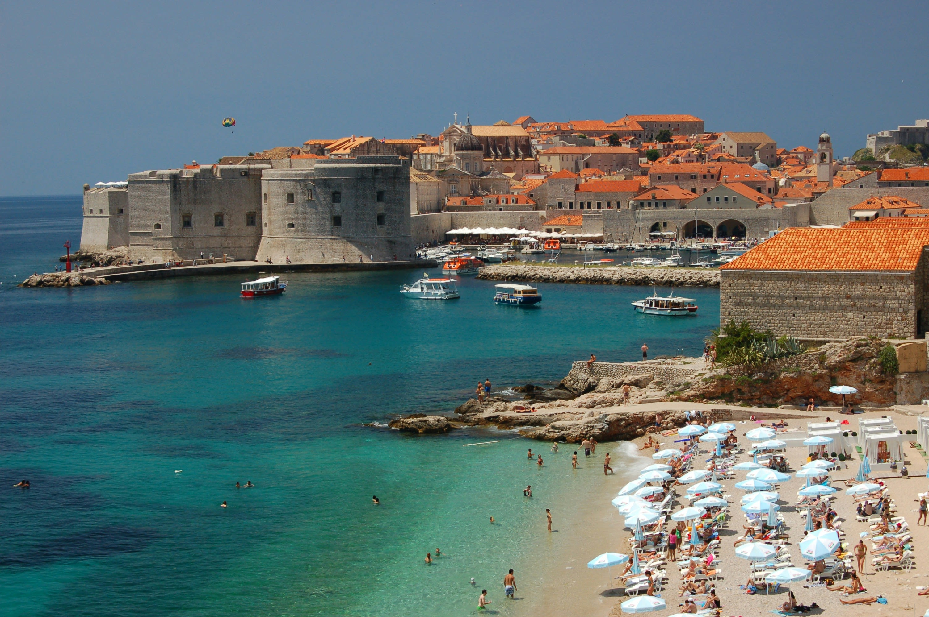 The walled old town of Dubrovnik seen across the water at dusk