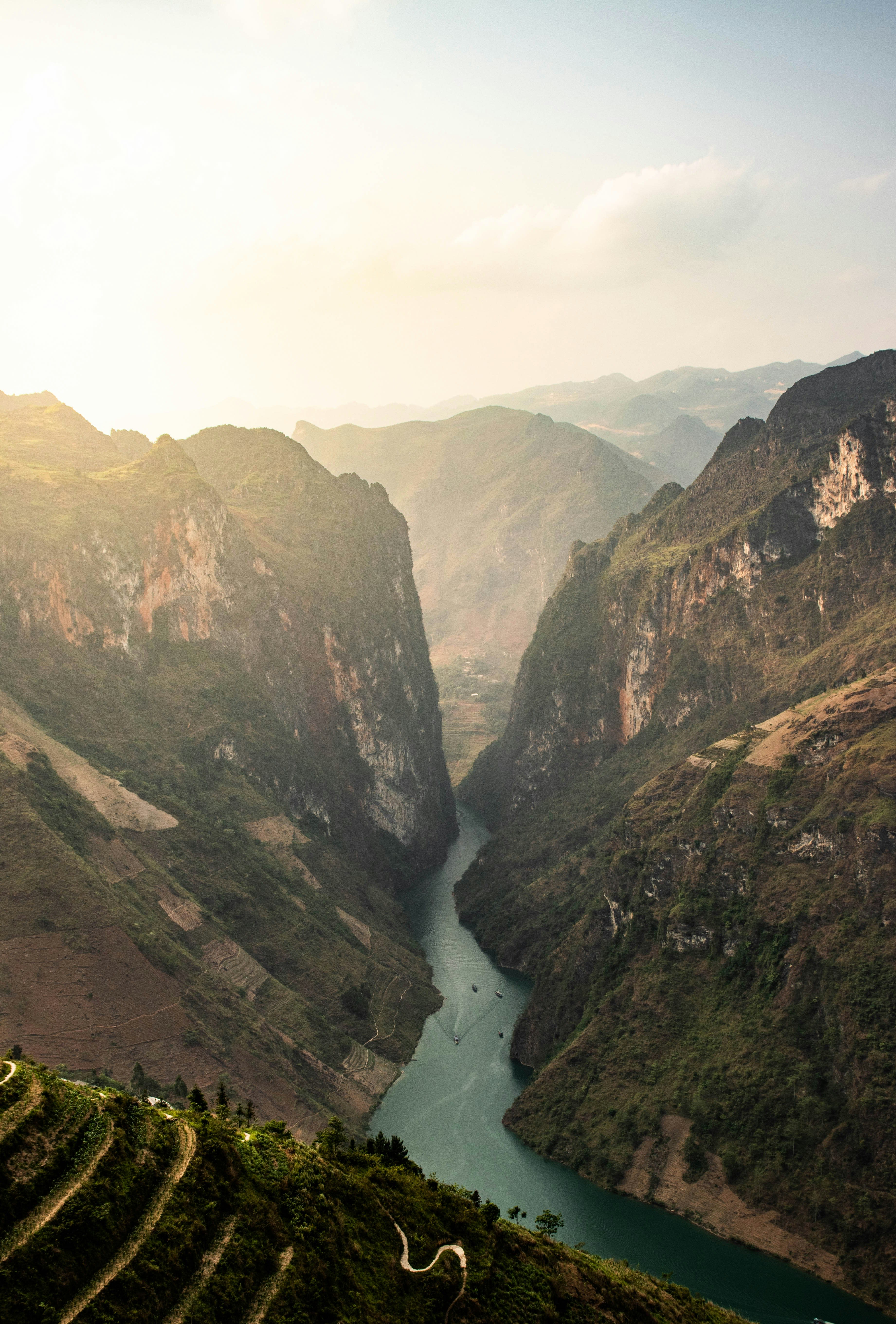 A green river winding through a deep limestone canyon