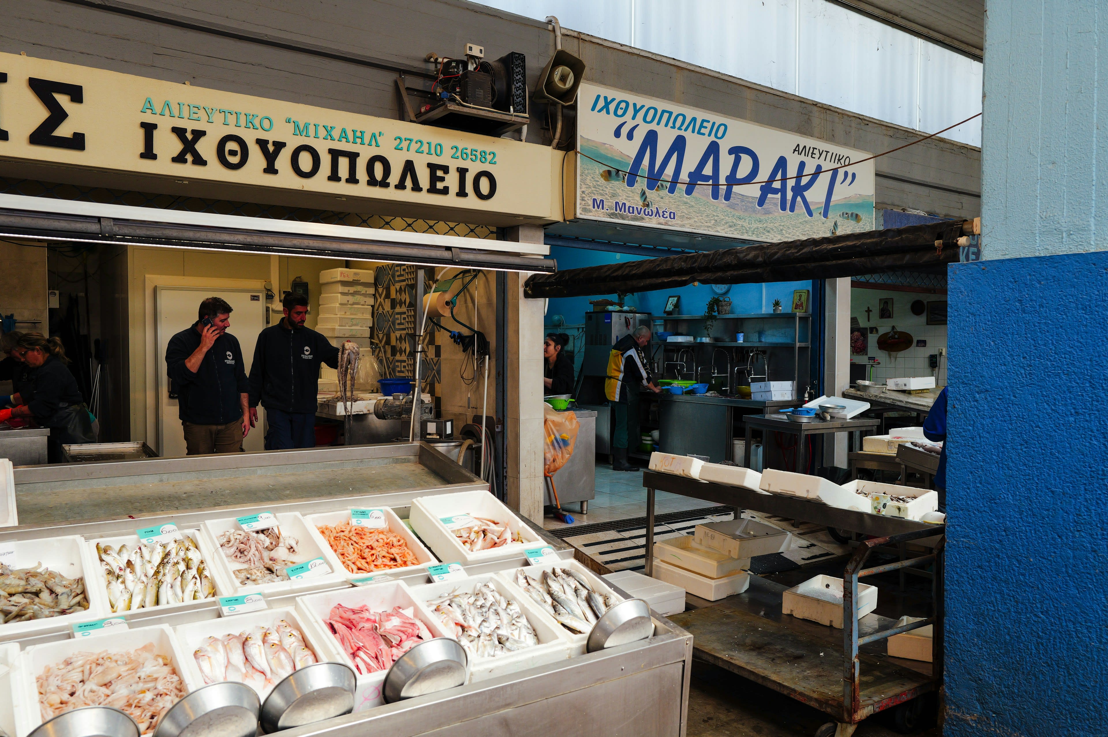 A Greek fishmonger's storefront with fresh fish on ice