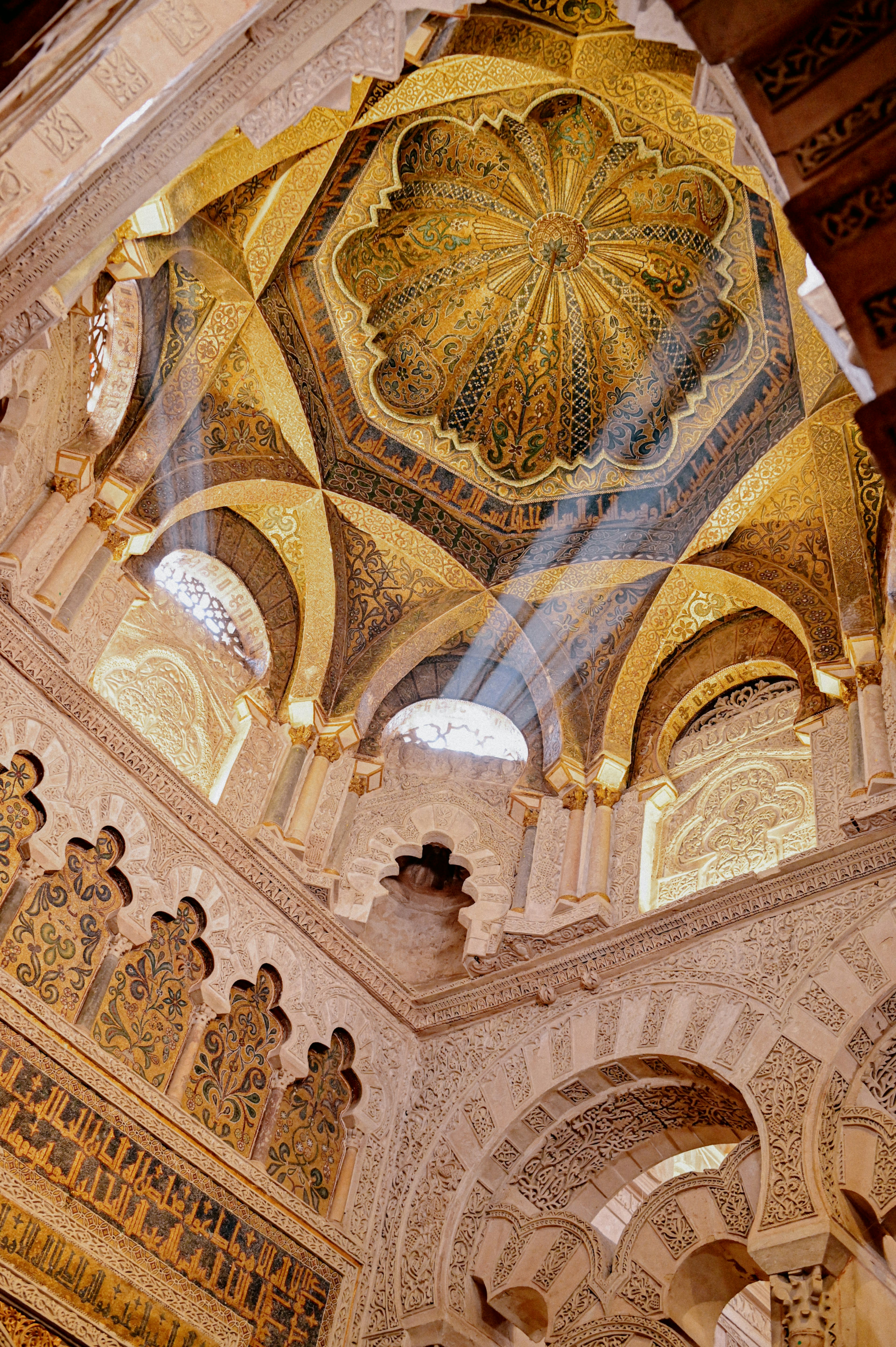 Ornate dome and arches of the Mezquita in pale stone