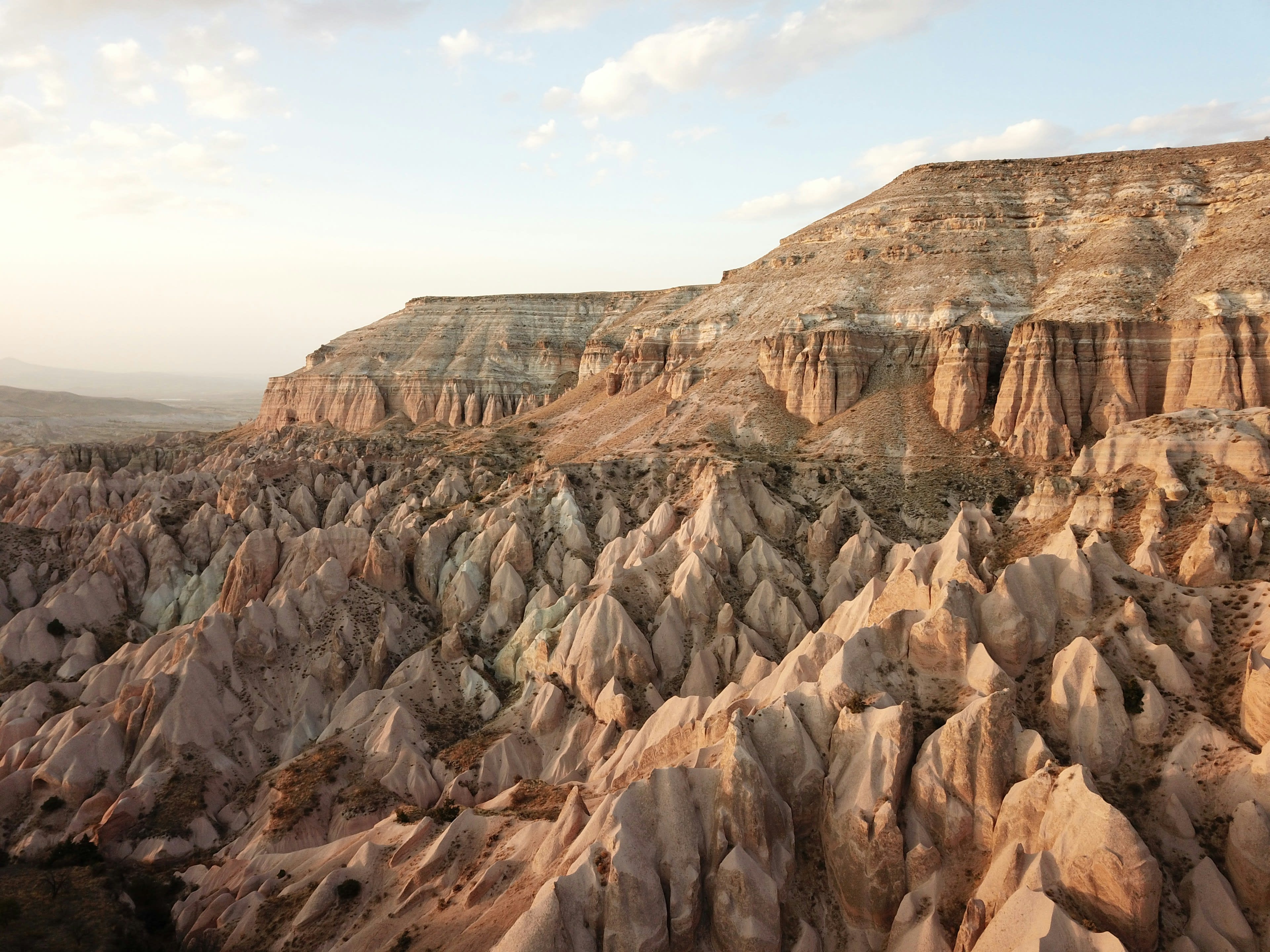 Folded red rock ridges under evening light