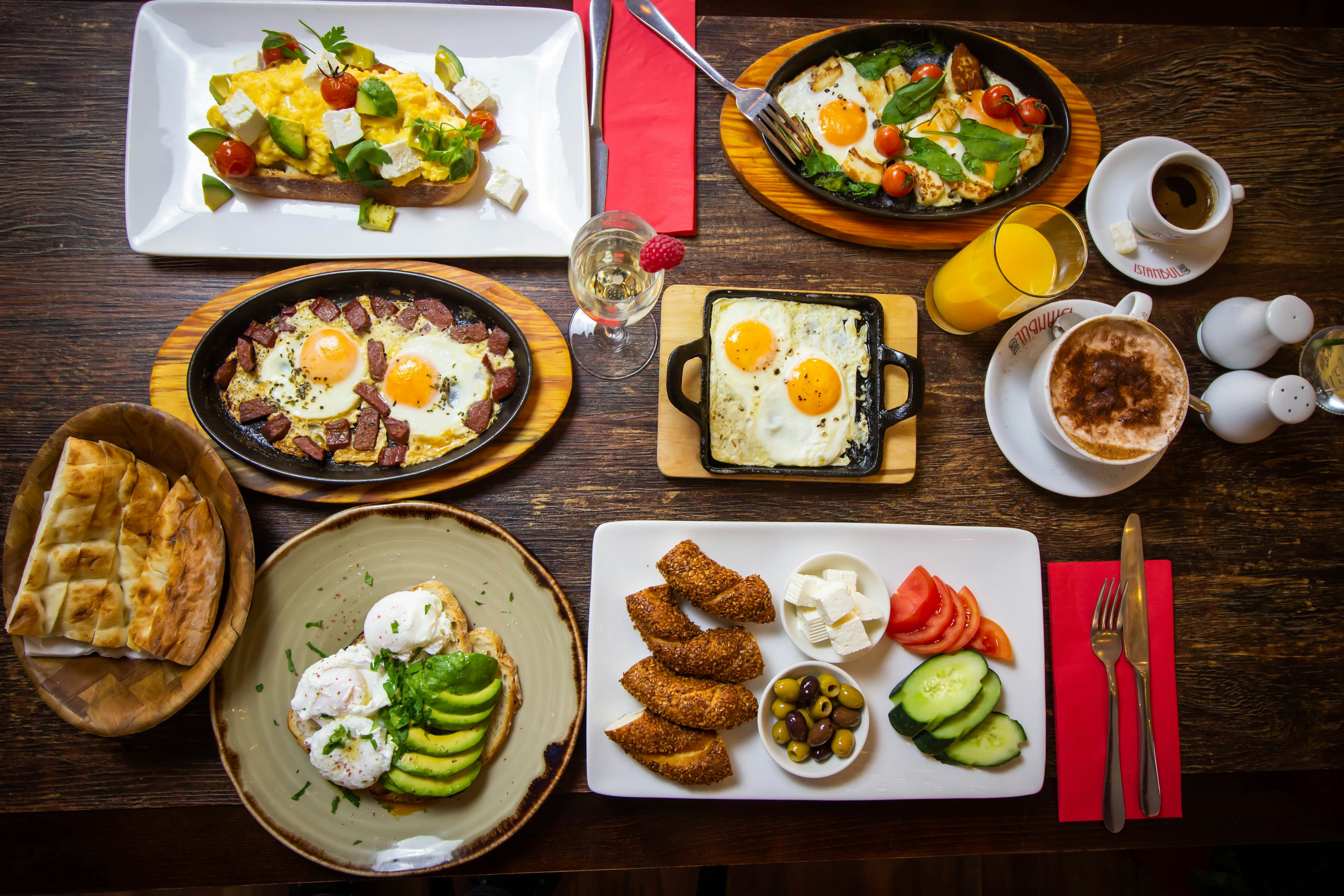 A table crowded with small plates of Turkish breakfast dishes
