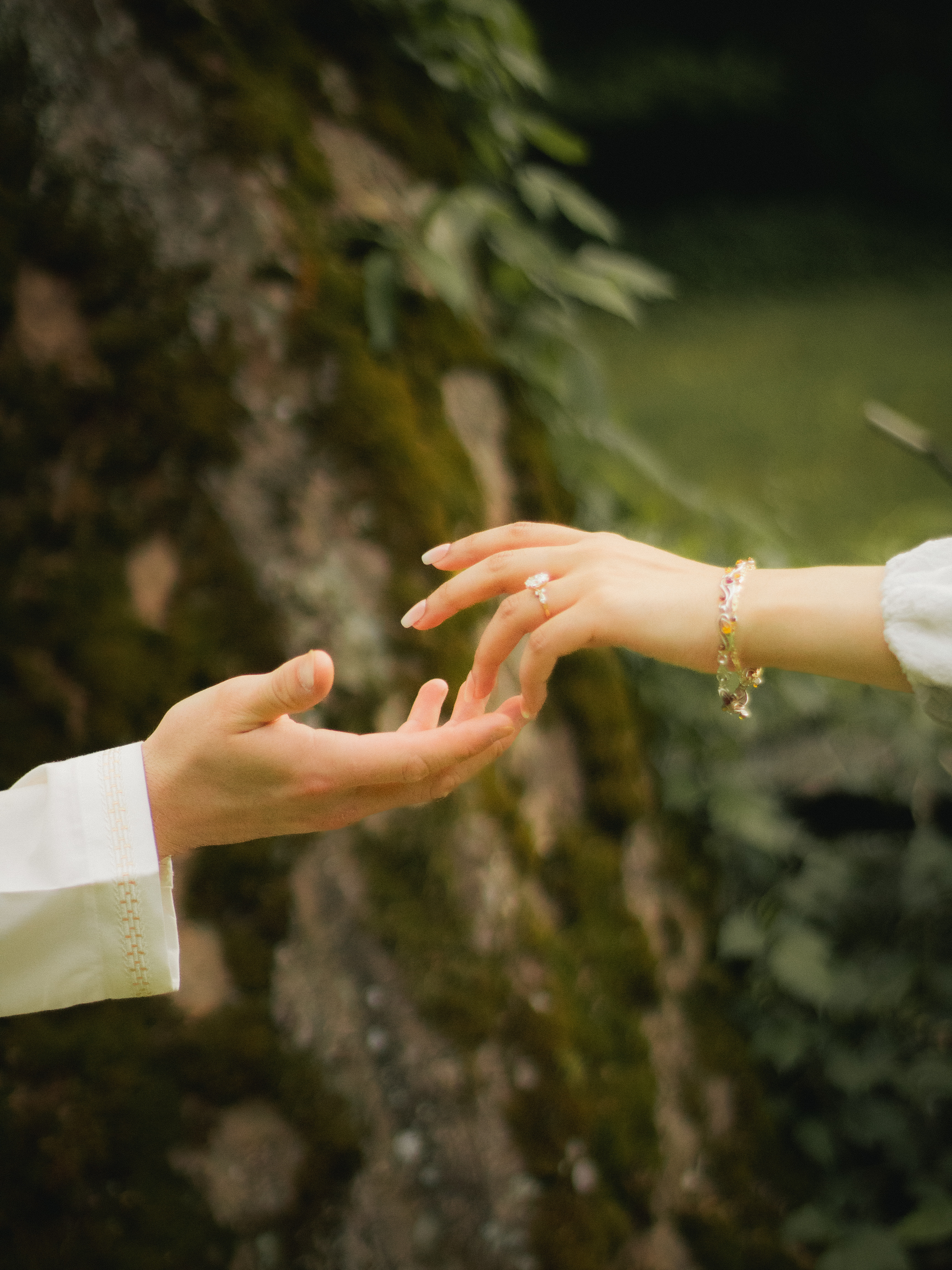 Hands reaching towards each other