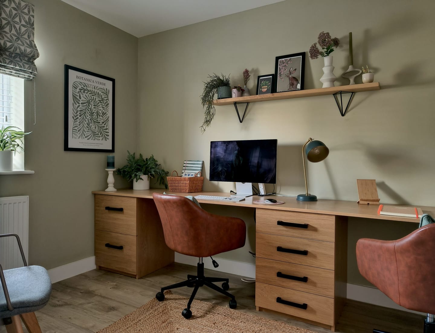Calm home office in green and oak
