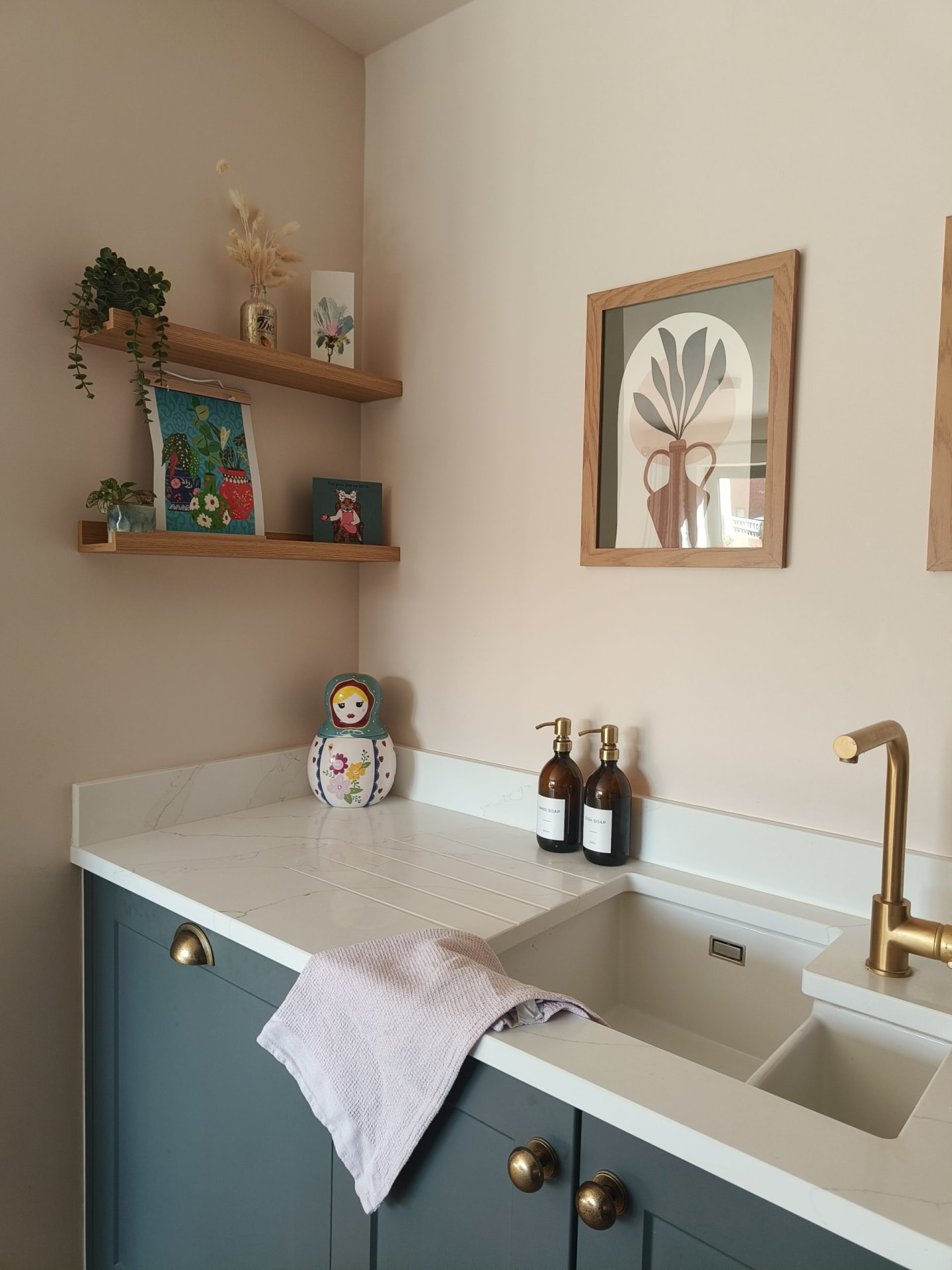 Sink area and oak shelves in kitchen