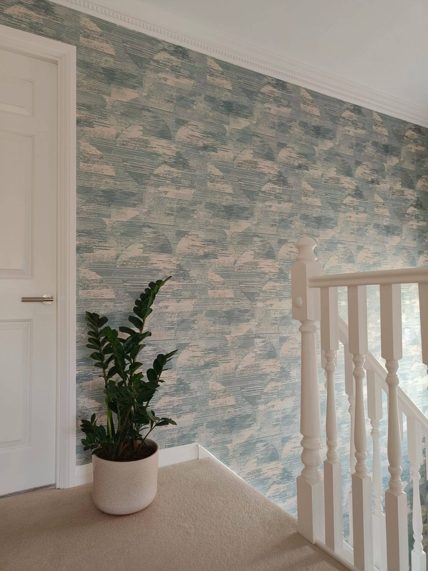 Textured blue wallpaper in calming hallway