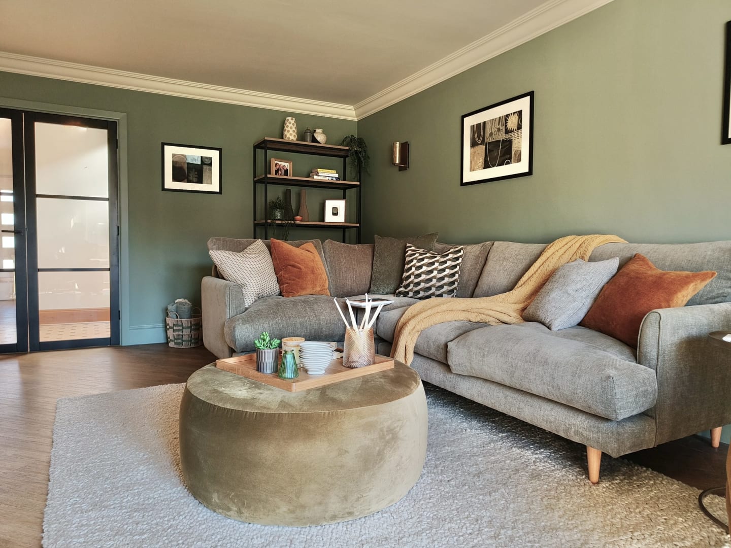 Olive green modern living room with rust and ochre accents