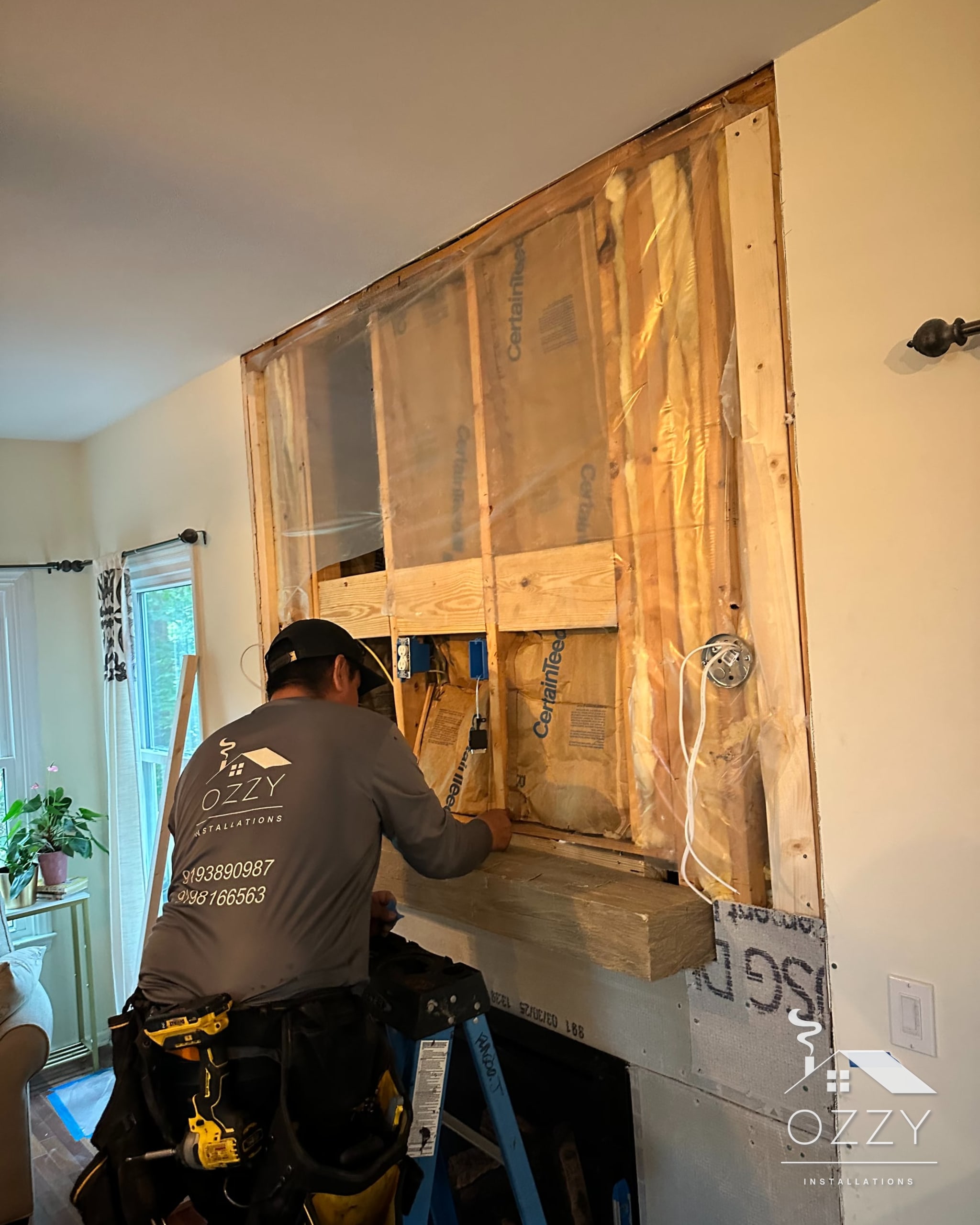 Crew member framing out a fireplace wall