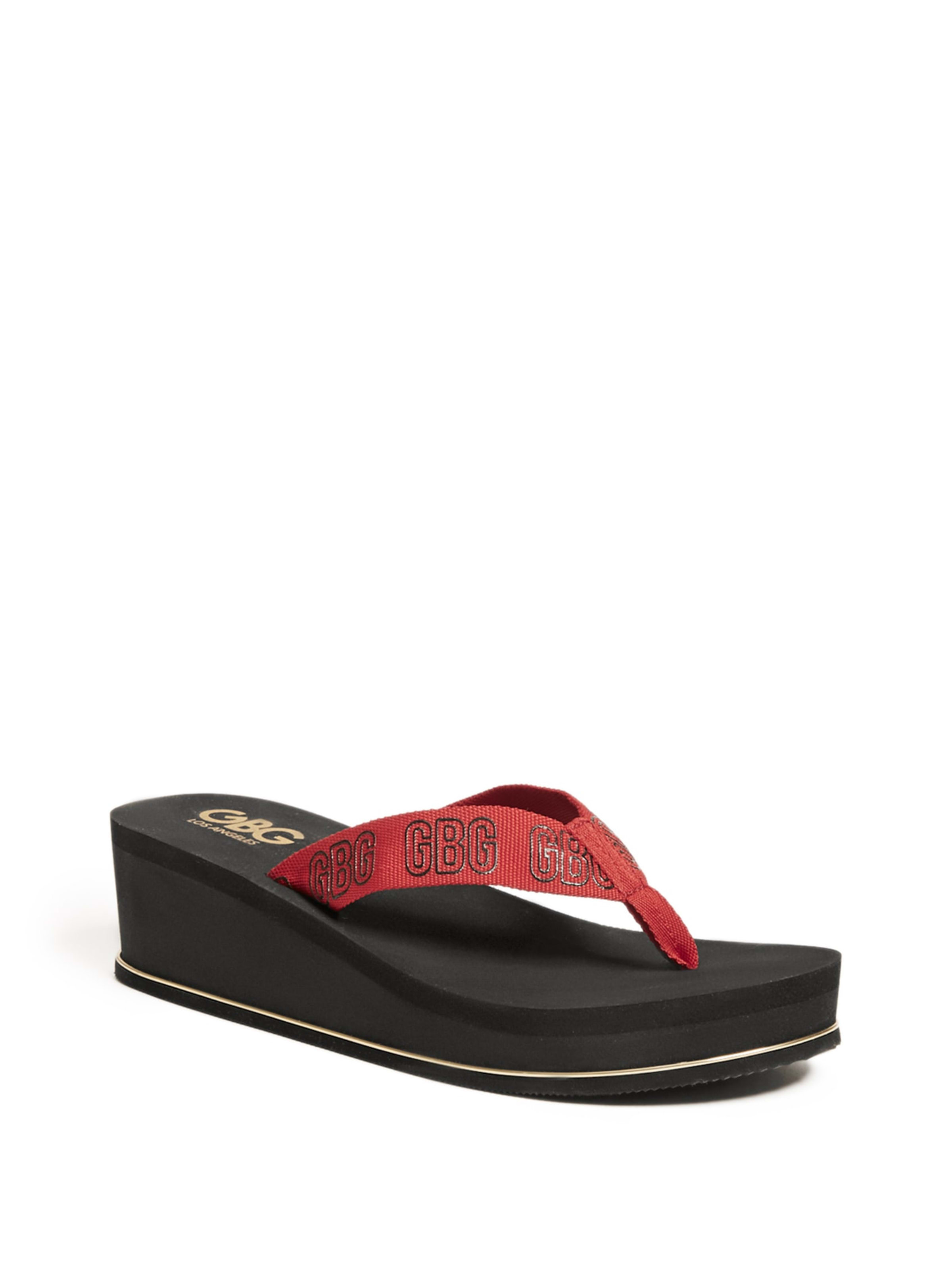 red guess flip flops