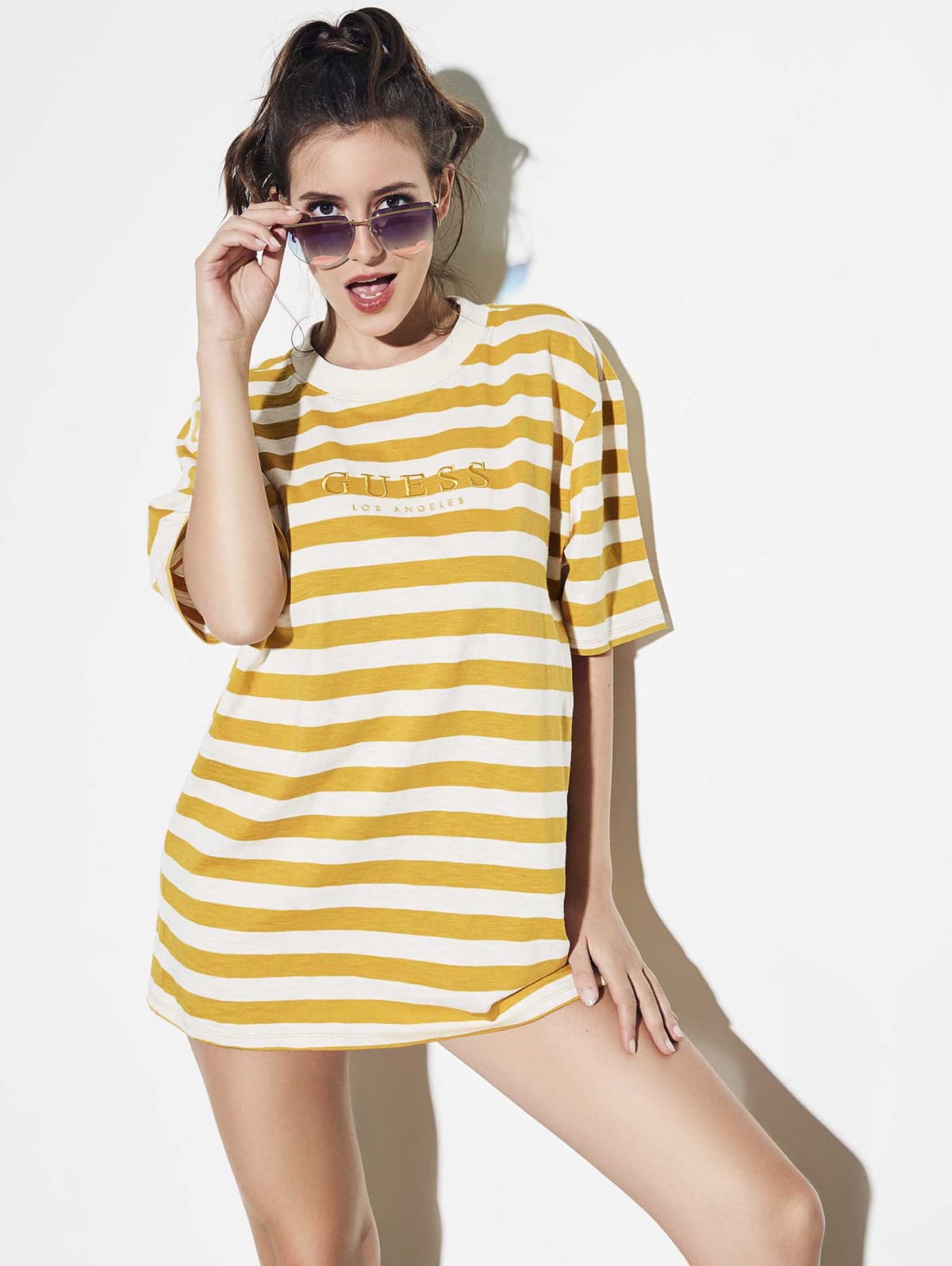 yellow and white guess shirt