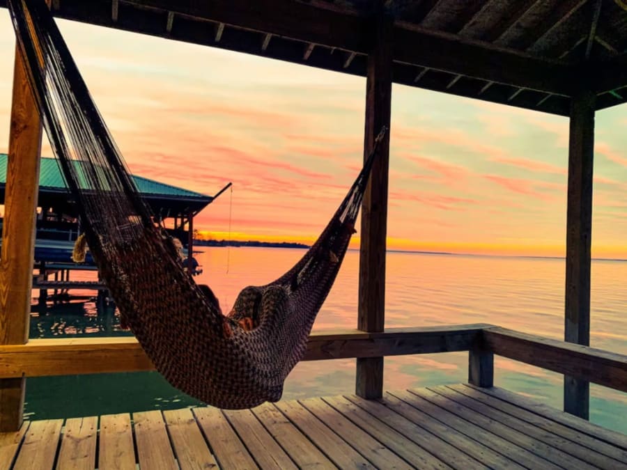 Hammock on the covered dock overlooking Lake Livingston at sunset