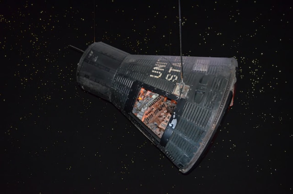 Photo of a black space capsule with an open door