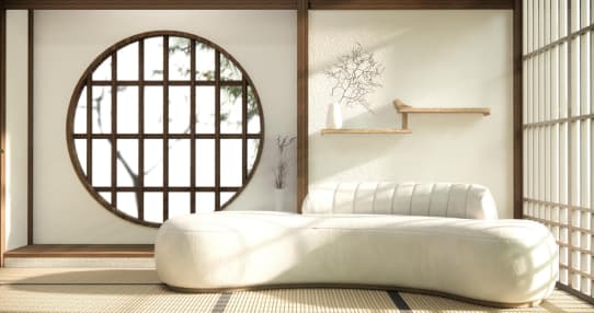 Convertible Japanese floor couch arranged as a reading lounge and daybed in a bright, open space.