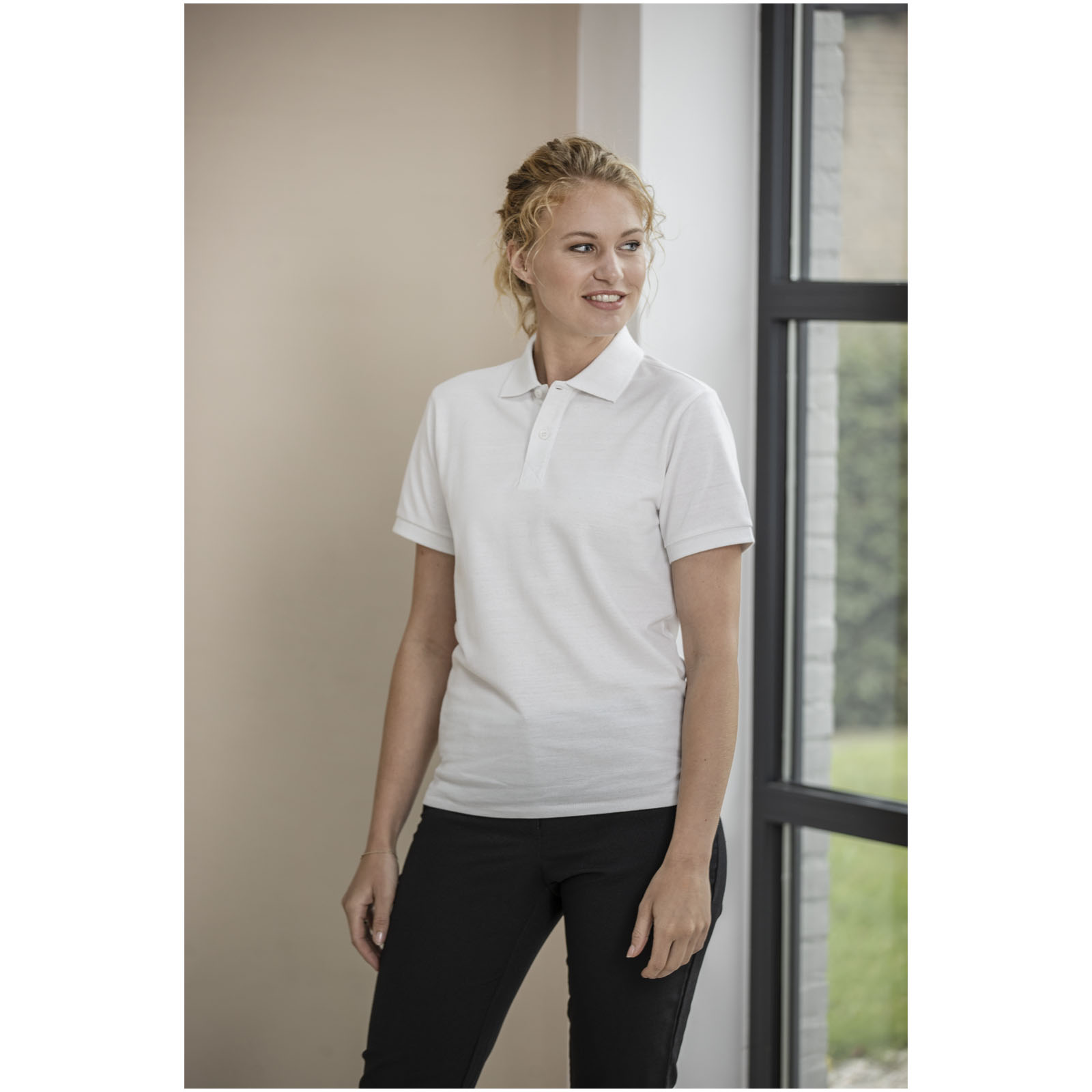 Polo de manga corta unisex con material reciclado Aware™ Emerald