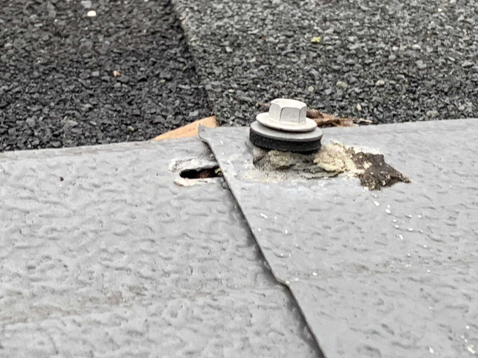 Gutter Helmet gutter guard improperly installed on top of roof shingles