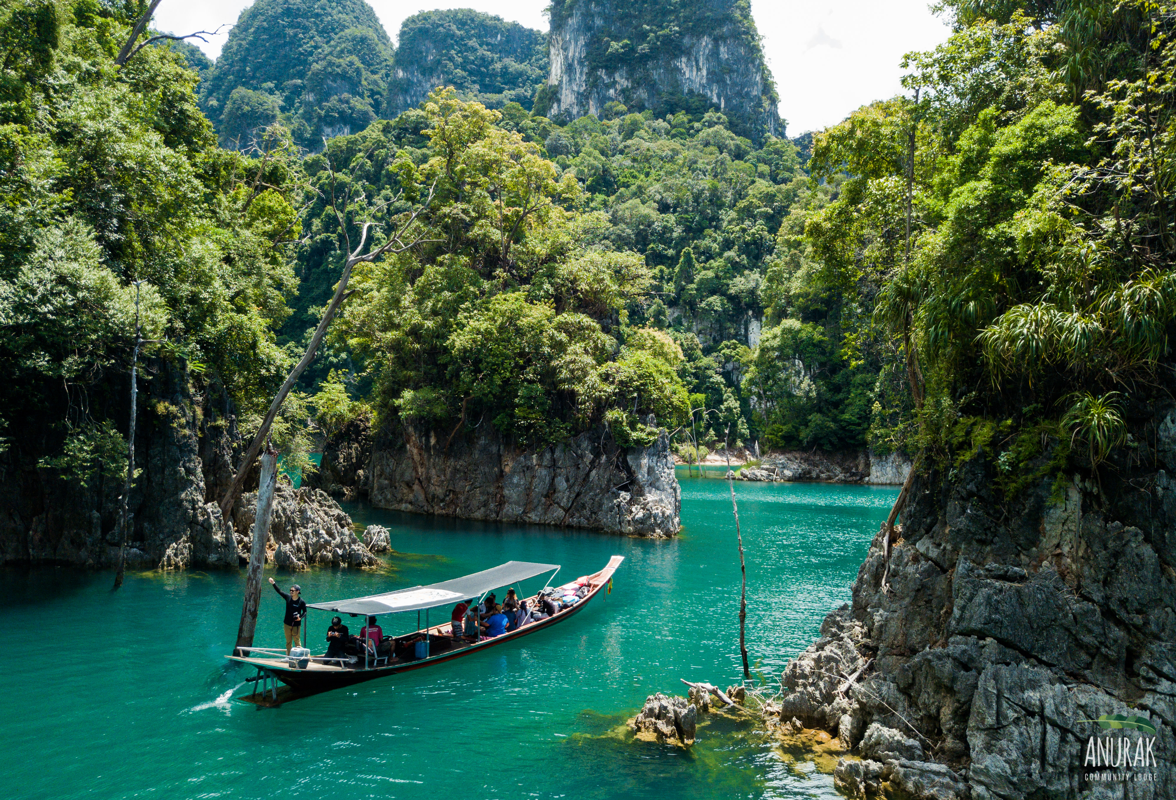 Cruise Cheow Lan Lake by traditional long-tail boat
