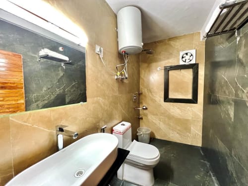Bathroom with marble finish and hot water