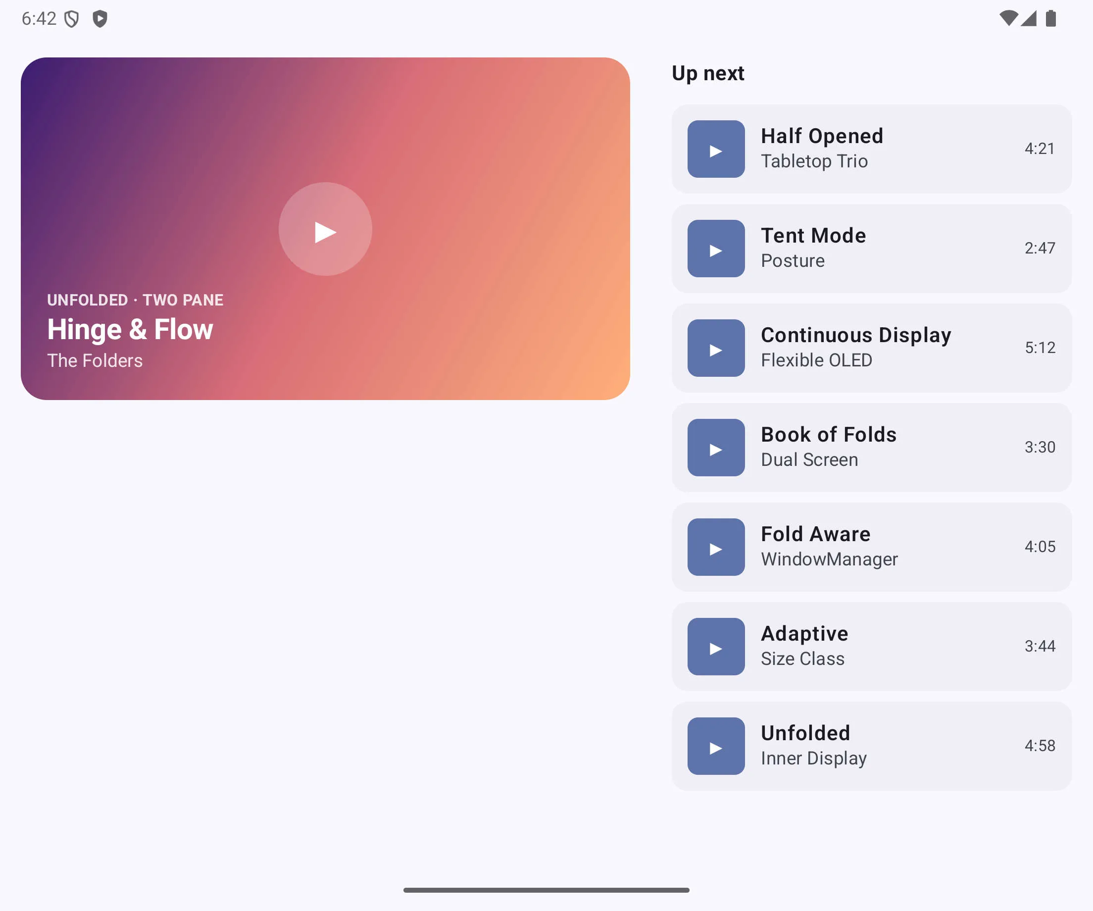 Unfolded inner display showing player and playlist side by side