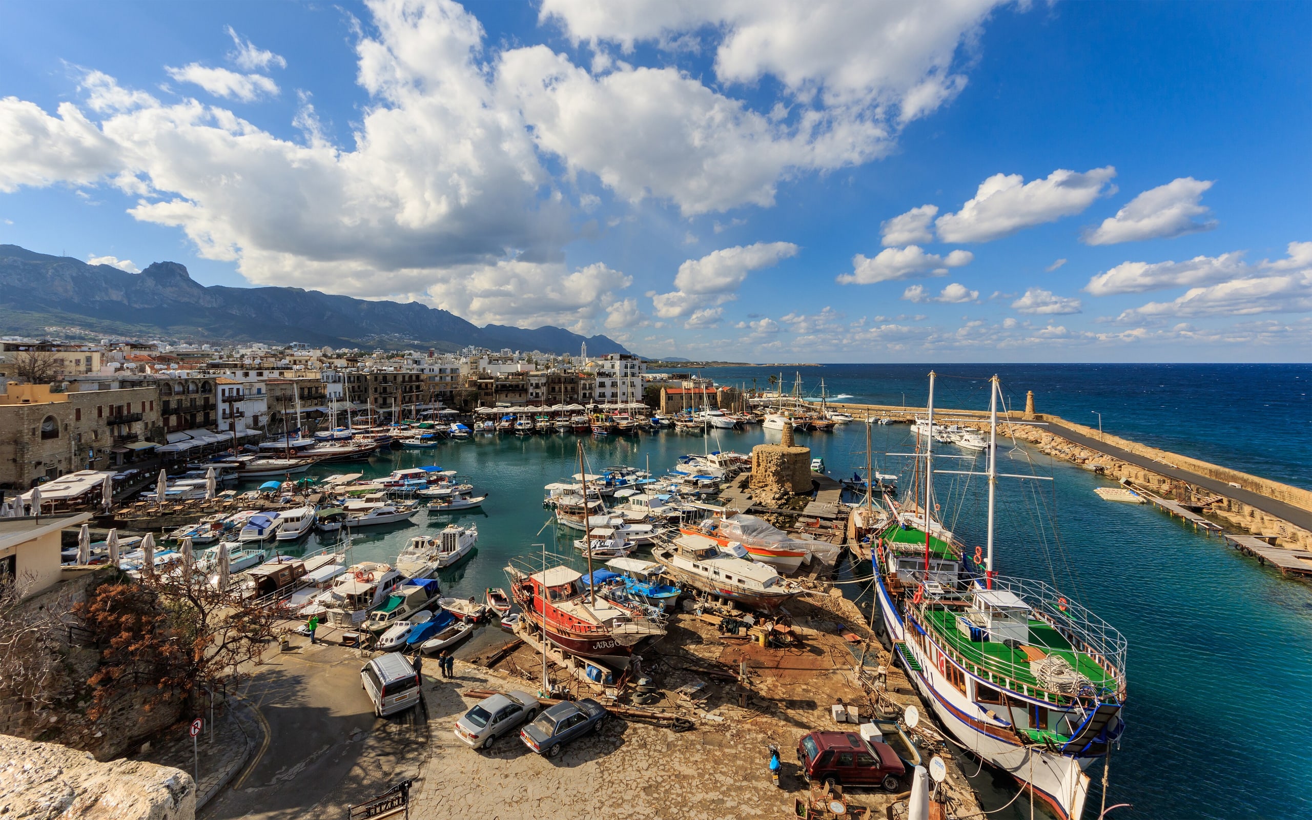 Kyrenia harbour with boats and mountains, Cyprus