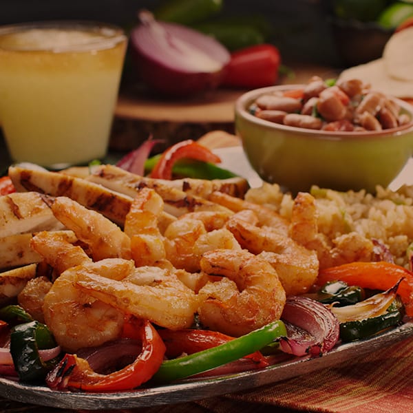 shrimp fajitas with side of rice and beans