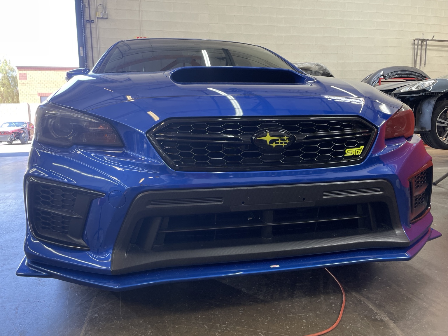 Blue Subaru STI with window tint installed by East Valley AutoWerks