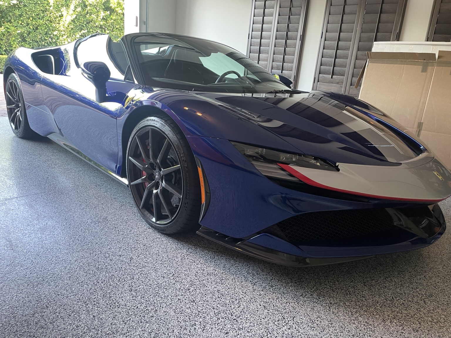 Blue Ferrari photographed at a private residence for East Valley AutoWerks mobile window tint service