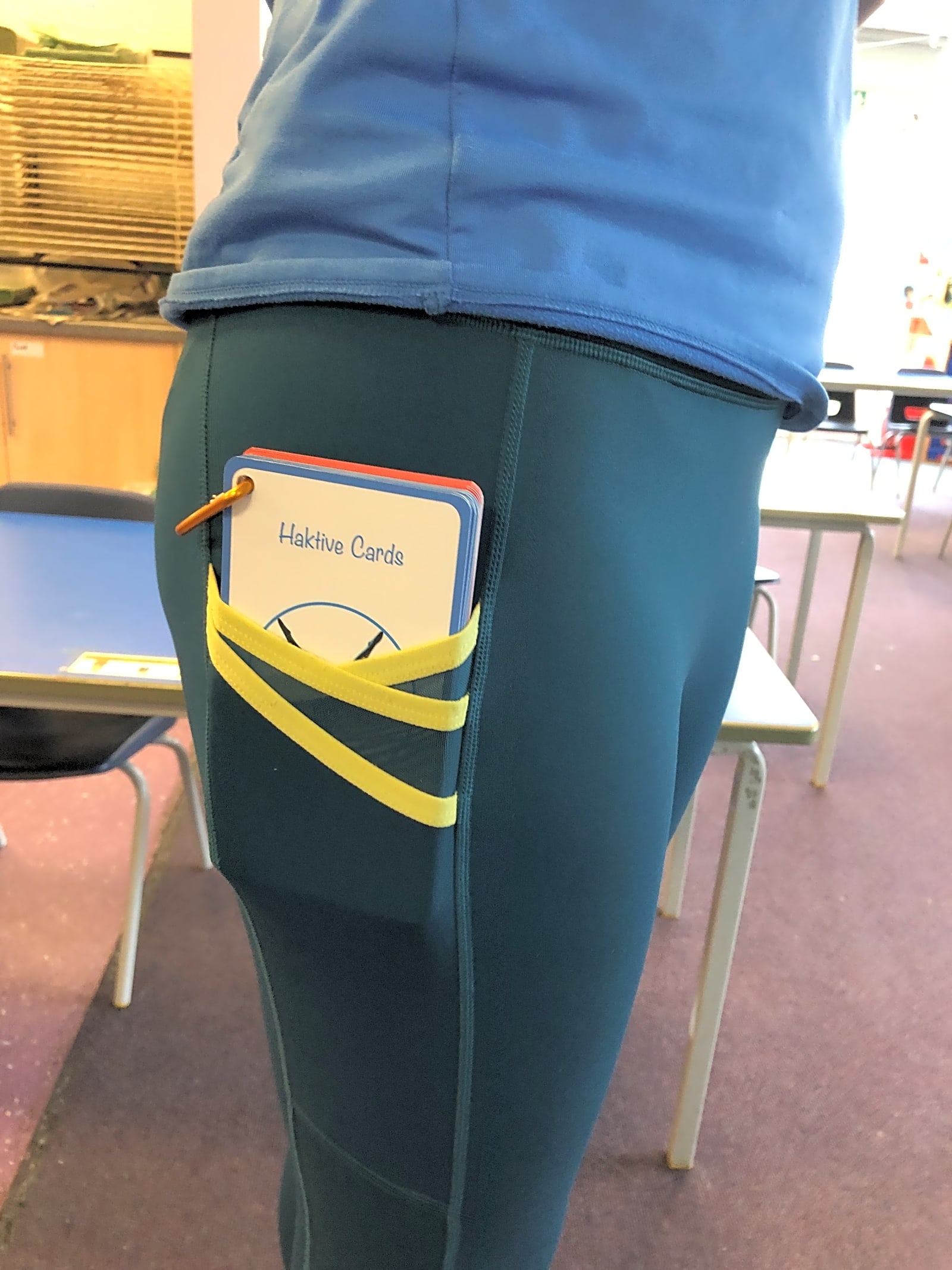 Haktive Cards tucked into a pocket — pocket-sized and ready to go
