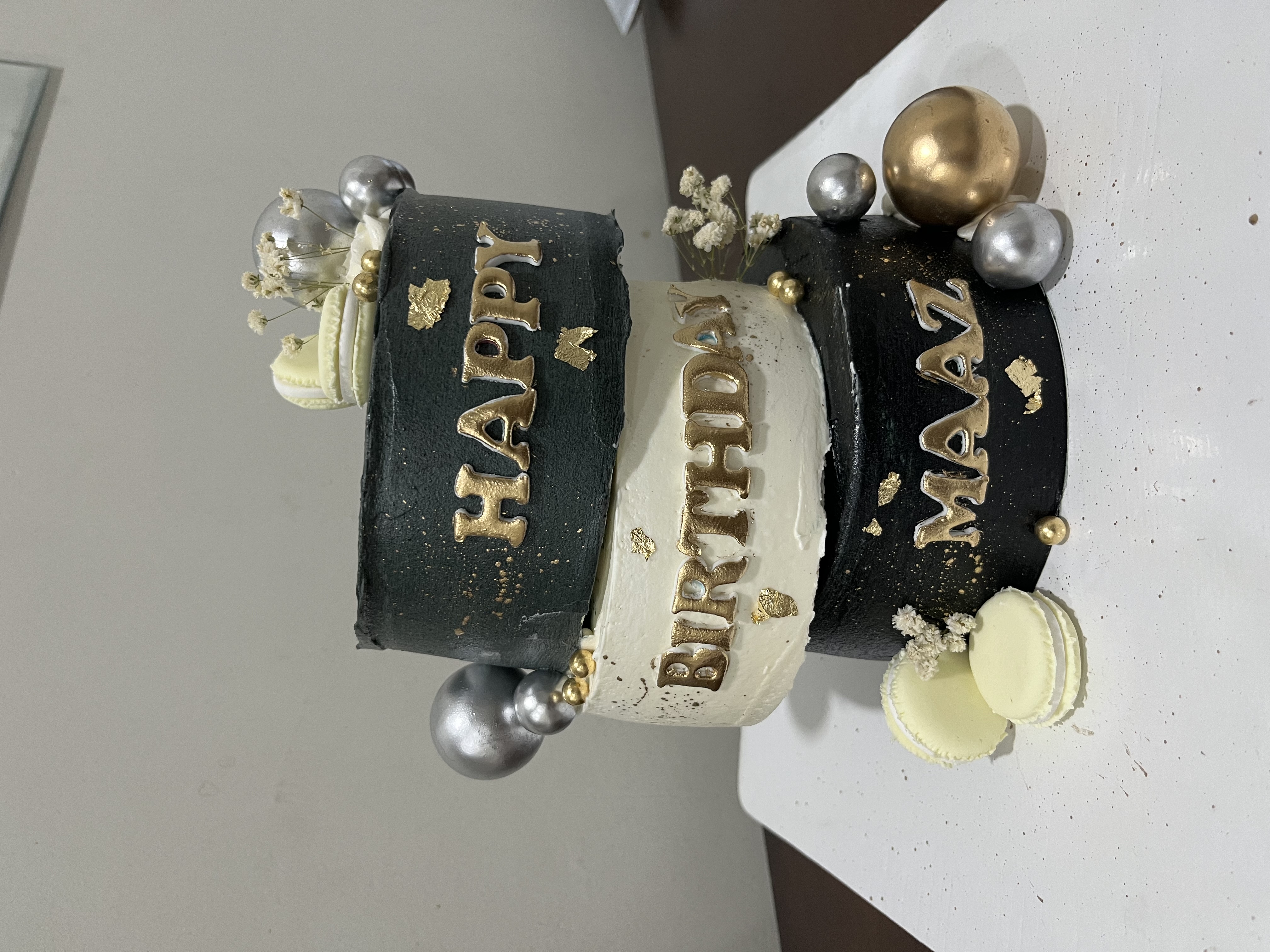 Black and Gold Tiered Birthday Cake